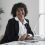 side-view-smiley-woman-working-desk